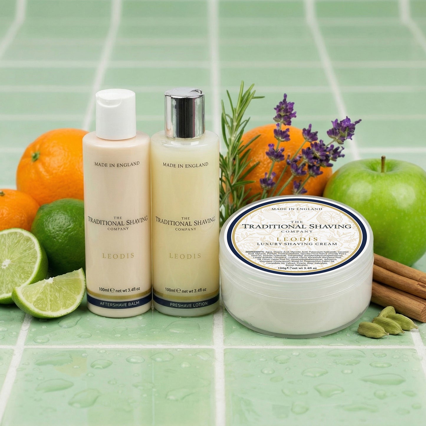 Shaving products with fruits and herbs on a green tiled background